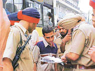 the police checks bill books of cassette vendors in the market