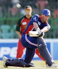 England�s Marcus Trescothick sweeps a delivery on way to making a century