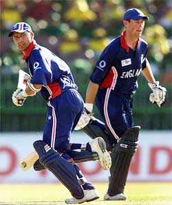 England's Marcus Trescothick and teammate and captain Nasser Hussain pass as they take a run during a preliminary pool match 