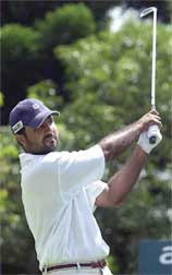 India's Amandeep Johl swings his ball