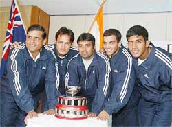 The Indian Davis Cup team pose with a replica of the Davis Cup