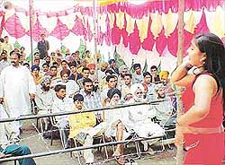 Menfolk of all ages watch a gir