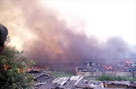 The smouldering remains of jhuggis