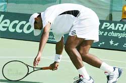 Leander Paes almost falls on the court