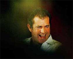 US actor and director Mel Gibson laughs as he addresses a news conference