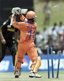 Adeel Raja of the Netherlands is clean bowled by Pakistan's Abdul Razzaq