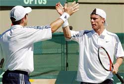 World No. 1 singles player Lleyton Hewitt of Australia celebrates with his doubles partner
