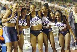 US 100 meter winner Marion Jones congratulates the American 100 meter relay team