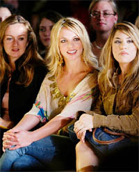 Pop singer Britney Spears watches from the front row