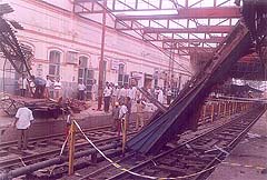 Railway personnel remove the girder