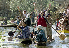 Kashmiri Muslim women shout slogans
