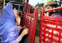 A lady police personnel pleads with her male counterpart
