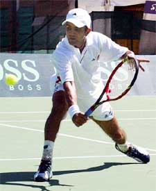 Harsh Manakad makes a volley in his Davis Cup match against Australia's Wayne Arthurs