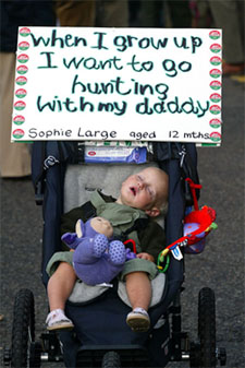 A child sleeps before the Countryside Alliance March for Liberty and Livelihood