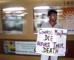 An activist of the Congress protests against a spate of suicides