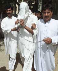 Plainclothes policemen escort Arsalan