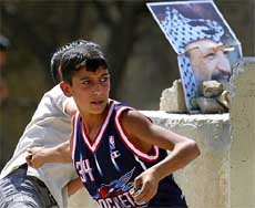 Palestinian boys throw stones 