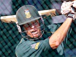 South Africa's captain Shaun Pollock hits a ball 