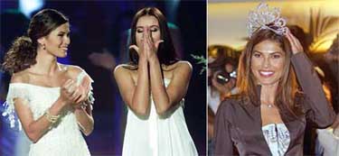 Miss Panama Justine Pasek looks on as Miss Russia Oxana Fedorova reacts