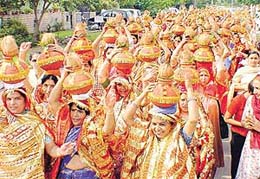 Devotees take part in a �kalassh yatra� on the eve of the arrival of Sant Asaram Bapu