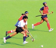 Two players battling for the ball 