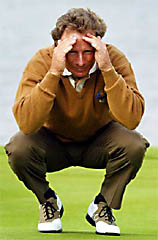 Germany's Bernhard Langer of the European team lines up a putt