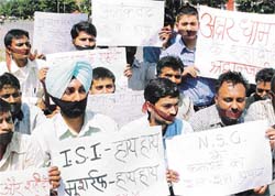 Bharatiya Janata Yuva Morcha activists hold a silent protest