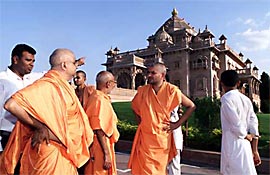 Sadhus from the Akshardham temple survey damage