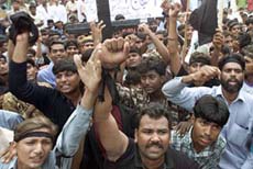Pakistani Christians chant slogans against religious violence during a rally in Karachi 
