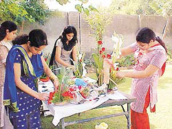 Participants at a flower arrangement competition at PCTE Campus for the function Koshish-2002.