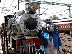 A man dressed as "Appu Guard" greets guests