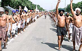Farmers raise their fists in protest