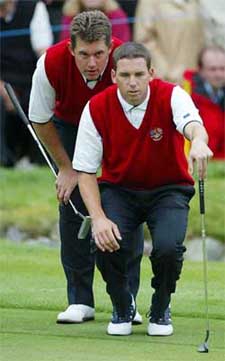 Europe's Sergio Garcia and partner Lee Westwood line up a putt on the seventh green during the 34th Ryder Cup at the Belfry near Birmingham