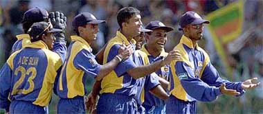 Sri Lankan players celebrate the wicket of Australia's batsman Adam Gilchrist