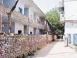 The boundary wall of the senior secondary school which has covered part of the public street behind the main market 