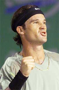 Spain's Carlos Moya reacts after winning the semi-final match
