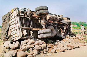 A loaded truck which overturned near the 3 BRD