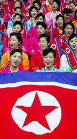 North Korean fans hold their national flag