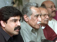Shahbaz Bhatti (L), leader of the All Pakistan Minorities Alliance