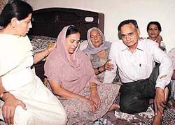 Warrant Officer G.S. Saini (retd) and Ms Neelam Saini, whose son Lt-Commander Rajesh Saini, died in a mid-air collision between two planes near Panaji, Goa, at their Sector 35 residence on Tuesday in Chandigarh.