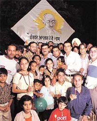 Members of the All-India Anti-Terrorist Front pay homage to those killed in recent riots in the country, in front of Mahatama Gandhi�s portrait in Sector 17, Chandigarh