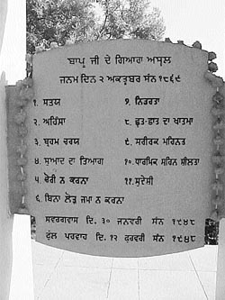 A plaque bears the 11 principles of Mahatma Gandhi, where his ashes had been immersed in the Sutlej