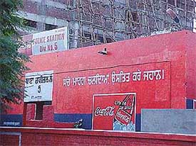 An advertisement painted on a wall of the Division No. 5 police station building