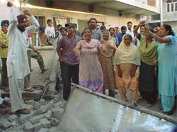 Angry residents of Sunet village protest against the demolition of a religious place
