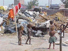 The MC demolition team removes jhuggis near Haibowal Dairy Complex on the Rajpura road