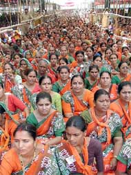 Indian women gather to take part in a march