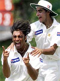 Pakistani bowler Shoaib Akhtar and Imarn Nazir celebrate after dismissing Australian captain Steve Waugh