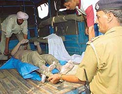 Police puts in truck the body of S.K. Khurana, an SDO in the Punjab Irrigation Department, that was found floating in the Sukhna in Chandigarh on Sunday