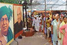 Life-size portraits of Haryana Chief Minister Om Prakash Chautala and Chaudhary Devi Lal dot the entrance to Mata Mansa Devi temple
