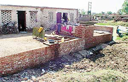 Houses coming up in a pond created by blocking the natural flow of a choe in Kishangarh. 